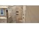 A bathroom featuring a shower with tile and inset shelving behind a clear glass door at 1415 Gooseneck Place # 101, Murrells Inlet, SC 29576