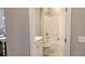 Bright bathroom featuring a tub-shower combo with tile surround, white vanity, and tile floors at 1415 Gooseneck Place # 101, Murrells Inlet, SC 29576
