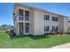 Charming two-story home featuring screened porches and a well-maintained lawn at 1415 Gooseneck Place # 101, Murrells Inlet, SC 29576