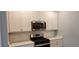Well-equipped kitchen with white cabinets, subway tile backsplash, and stainless steel appliances at 1415 Gooseneck Place # 101, Murrells Inlet, SC 29576