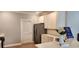 Bright and modern kitchen featuring white cabinets, quartz countertops, stainless steel appliances, and plank flooring at 1415 Gooseneck Place # 101, Murrells Inlet, SC 29576