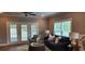 Cozy living room with a comfortable sofa, decorative pillows, and French doors at 1415 Gooseneck Place # 101, Murrells Inlet, SC 29576