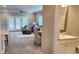 Inviting living area with hardwood floors, french doors, comfortable seating, and natural light at 1415 Gooseneck Place # 101, Murrells Inlet, SC 29576