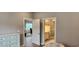 Spacious main bedroom featuring an attached bathroom and a comfortable sitting area at 1415 Gooseneck Place # 101, Murrells Inlet, SC 29576
