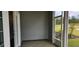 Relaxing covered outdoor patio with pond view and screen door at 1415 Gooseneck Place # 101, Murrells Inlet, SC 29576