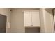 A storage area featuring a cabinet with a white door and brushed nickel hardware at 1415 Gooseneck Place # 101, Murrells Inlet, SC 29576