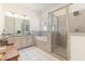 Bright bathroom with a soaking tub, glass-enclosed shower, and neutral tile work, creating a spa-like experience at 1423 Peterson St., Myrtle Beach, SC 29577