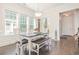 Charming dining room filled with natural light, highlighted by wainscoting, a chandelier, and a classic table set at 1423 Peterson St., Myrtle Beach, SC 29577