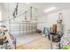 Garage interior with overhead door, various storage items, and utility equipment at 1423 Peterson St., Myrtle Beach, SC 29577