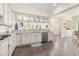 Bright kitchen featuring white cabinets, granite counters, and stainless steel appliances at 1423 Peterson St., Myrtle Beach, SC 29577