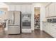 Modern kitchen with stainless steel appliances, white cabinets, and an adjacent pantry at 1423 Peterson St., Myrtle Beach, SC 29577