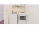 Laundry area with washer and dryer hookups and white shelving for storage at 1423 Peterson St., Myrtle Beach, SC 29577