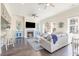 Cozy living room with a fireplace, ceiling fans, and comfortable seating arrangements at 1423 Peterson St., Myrtle Beach, SC 29577