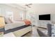Comfortable main bedroom featuring a ceiling fan, access to a private balcony, and a neutral color scheme at 1423 Peterson St., Myrtle Beach, SC 29577