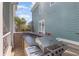 Outdoor built-in kitchen area with bar seating and stainless steel grill at 1423 Peterson St., Myrtle Beach, SC 29577