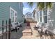 Charming brick patio featuring a cozy fire pit, outdoor seating, and a built-in bar area at 1423 Peterson St., Myrtle Beach, SC 29577