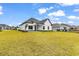 Charming modern home with a well-manicured lawn and tidy landscaping creates great curb appeal at 144 Sago Palm Dr., Myrtle Beach, SC 29579
