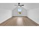 Bright bedroom with vaulted ceilings, wood-look flooring, and a view of the neighborhood at 144 Sago Palm Dr., Myrtle Beach, SC 29579