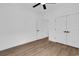 Clean bedroom with hardwood floors, a ceiling fan, a closet, and an open doorway at 144 Sago Palm Dr., Myrtle Beach, SC 29579