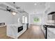 Gourmet kitchen boasts a marble island, stainless steel appliances, and recessed lighting at 144 Sago Palm Dr., Myrtle Beach, SC 29579