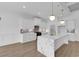 Spacious kitchen features a marble island, modern appliances, and ample cabinet space at 144 Sago Palm Dr., Myrtle Beach, SC 29579