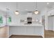 Bright kitchen with a large marble island, stylish pendant lighting, and a modern design at 144 Sago Palm Dr., Myrtle Beach, SC 29579