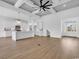 Open-concept design highlighting the modern kitchen island and coffered ceilings at 144 Sago Palm Dr., Myrtle Beach, SC 29579