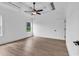 Spacious main bedroom features tray ceiling, ceiling fan, and wood floors at 144 Sago Palm Dr., Myrtle Beach, SC 29579