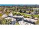 A multi-unit building complex is shown from above overlooking a golf course, ponds, and the ocean at 1500 Cenith Dr. # E302, North Myrtle Beach, SC 29582