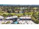 A multi-unit building overlooking a golf course and ponds, with an ocean view and blue pool at 1500 Cenith Dr. # E302, North Myrtle Beach, SC 29582