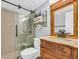 Bathroom with a vanity, decorative mirror, and a glass-enclosed shower with bench at 1500 Cenith Dr. # E302, North Myrtle Beach, SC 29582