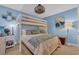 Charming bedroom featuring a bunk bed, blue walls, and decorative touches at 1500 Cenith Dr. # E302, North Myrtle Beach, SC 29582