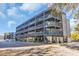 This four-story building has wood and steel accents, multiple balconies, and convenient covered parking at 1500 Cenith Dr. # E302, North Myrtle Beach, SC 29582