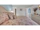 Comfortable main bedroom featuring a floral bedspread, bedside table, and artwork at 1500 Cenith Dr. # E302, North Myrtle Beach, SC 29582