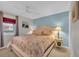 Cozy main bedroom with a large bed, bedside tables, and neutral colored carpet and walls at 1500 Cenith Dr. # E302, North Myrtle Beach, SC 29582