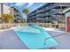 Enjoy the large rectangular community pool surrounded by lounge chairs and condos under sunny skies at 1500 Cenith Dr. # E302, North Myrtle Beach, SC 29582