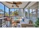 Relaxing screened porch featuring comfortable seating, ceiling fan, and lovely views of trees at 1500 Cenith Dr. # E302, North Myrtle Beach, SC 29582