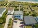 Aerial view of a light blue beach house with private parking and boardwalk beach access at 164 Vineyard Place # 23, Pawleys Island, SC 29585