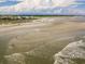 Panoramic view of the beach, highlighting the expansive shoreline and clear waters at 164 Vineyard Place # 23, Pawleys Island, SC 29585