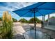 Inviting deck with an umbrella, seating area, and serene outdoor living space at 164 Vineyard Place # 23, Pawleys Island, SC 29585