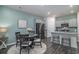 Stylish eat-in kitchen with stainless steel appliances, granite countertops, and a cozy dining area for four at 164 Vineyard Place # 23, Pawleys Island, SC 29585