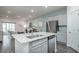 Bright kitchen with a central island, stainless steel appliances, and an open layout connecting to the living space at 164 Vineyard Place # 23, Pawleys Island, SC 29585