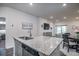 Open-concept kitchen with island, granite countertops, and stainless steel dishwasher at 164 Vineyard Place # 23, Pawleys Island, SC 29585