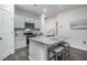 Modern kitchen with granite countertops, stainless steel appliances, and a convenient breakfast bar with seating at 164 Vineyard Place # 23, Pawleys Island, SC 29585