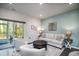 Inviting living room with a cozy seating arrangement, stylish decor, and access to a screened porch, perfect for relaxing at 164 Vineyard Place # 23, Pawleys Island, SC 29585