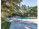 Community pool surrounded by trees, offering a refreshing retreat for residents at 164 Vineyard Place # 23, Pawleys Island, SC 29585