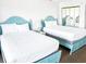 Double beds in a blue and white decorated room with a mirrored closet at 205 74Th Ave. N # 904, Myrtle Beach, SC 29572