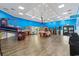 Spacious game room features a variety of arcade games and activities for all ages, with vibrant blue walls at 205 74Th Ave. N # 904, Myrtle Beach, SC 29572