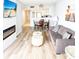 Cozy living room with open floor plan to the kitchen, dining area, and fireplace at 205 74Th Ave. N # 904, Myrtle Beach, SC 29572