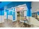 Inviting entrance to Fish Shanty restaurant features bright blue walls, white trim, and a peek into the dining area at 205 74Th Ave. N # 904, Myrtle Beach, SC 29572
